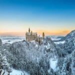 Neuschwanstein Castle at sunset in winter landscape. Germany