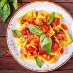 Ravioli,With,Tomato,Sauce,And,Basil,On,Dark,Background,,Top